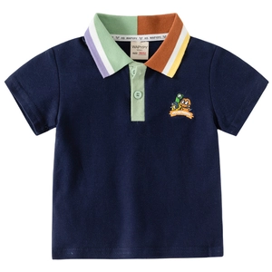 Boys navy blue polo shirt with colorful patchwork collar and cartoon monster embroidery