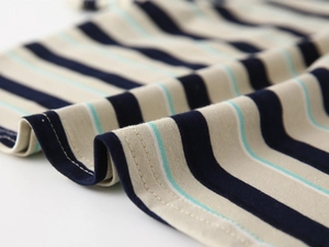 Detail of boys' polo shirt featuring fine knit stripes and durable double-stitch seams