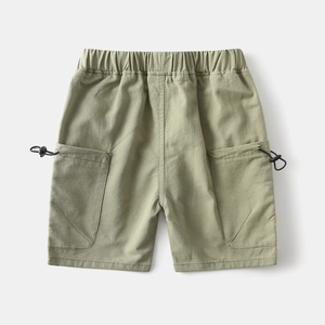 Detail of boys' cargo shorts featuring elastic waistband and adjustable toggle pockets