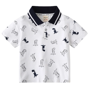Boys white cotton short sleeve polo shirt featuring all-over navy cartoon dinosaur prints