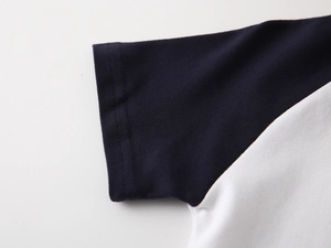 Detail showing blue and white patchwork sleeve with breathable mesh cotton fabric