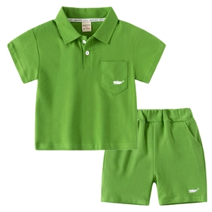 Kids green short sleeve polo shirt and shorts set with whale embroidery on pure white background