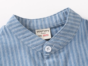Close-up of kids striped shirt V-neck collar with brand label and fine stitching details