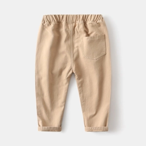 Detail of khaki cotton casual pants for boys showing elastic waistband and back pocket