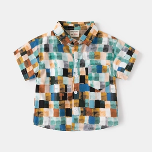 Vibrant boys' short-sleeved shirt with colorful abstract grid print and chest pocket