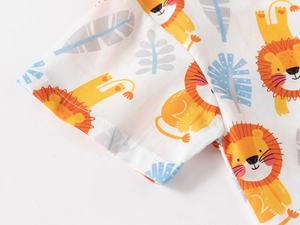 Detail of baby shirt sleeve with yellow cartoon lion print and fine stitching