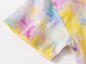 Macro detail of toddler short sleeve shirt with colorful marble print and neat stitching