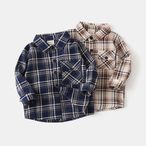 Detail of classic plaid flannel shirts for boys with front pocket and button-down collar
