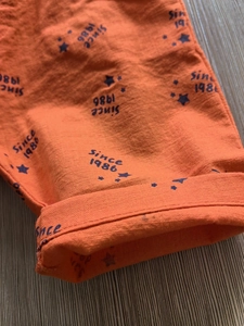 Kids orange cotton shorts with Since 1986 star print and breathable fabric detail
