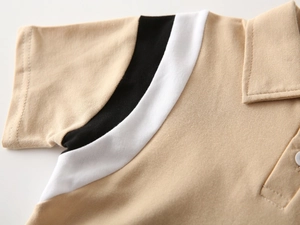 Detailed close-up of khaki polo shirt showing pique cotton texture and contrast seams