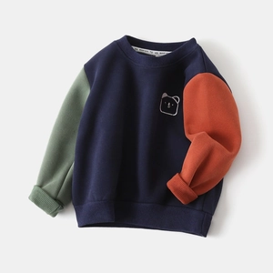 Detail of color-block kids sweatshirt featuring navy body and cute white bear embroidery