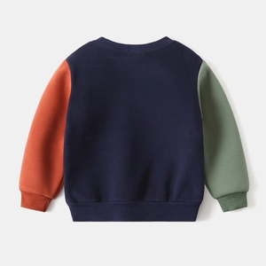 Detail view of the back of a kids' fleece sweatshirt with colorful tri-tone patchwork design