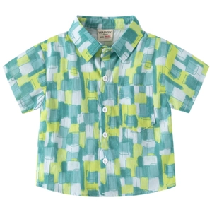 Kids short sleeve shirt with green and yellow geometric print on white background