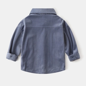 Detail view of the back of a greyish-blue corduroy long-sleeved shirt for boys