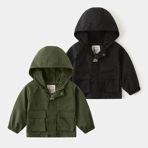 Detail of hooded kids windbreaker jackets with snap flap pockets in olive and black