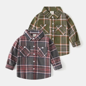 Detailed view of kids brushed flannel shirts with classic plaid patterns and dual chest pockets