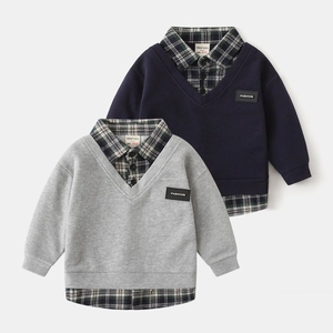 Detail view of double-layered kids sweatshirts featuring plaid shirt collar and faux vest design