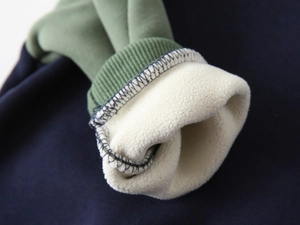 Close-up of boys thick fleece lining and ribbed cuffs on warm winter sweatshirt