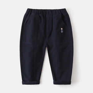 Detail of navy blue kids trousers showing elastic waistband and bear embroidery