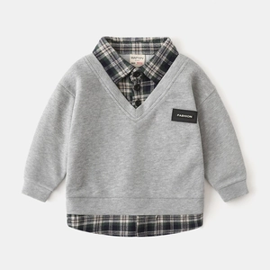 Detail of boys' layered grey sweatshirt with a plaid shirt collar and fashion leather patch