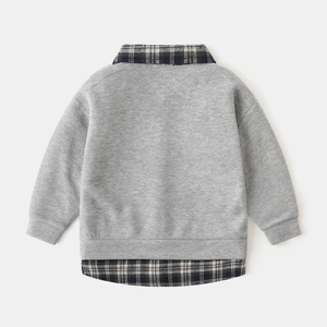 Detailed back view of kids gray faux two-piece sweatshirt with green plaid shirt hem