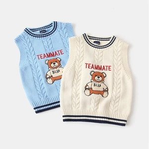 Detailed cable knit pattern on children's vests with bear embroidery and stripe trim