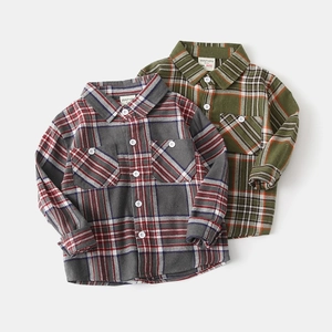 Detailed close-up of flannel plaid shirts featuring chest pockets and soft brushed texture