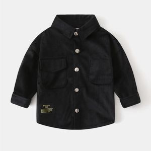 Close-up of black corduroy fabric texture and silver metal buttons on a boy's shirt