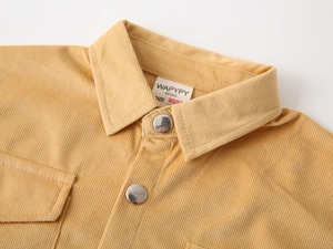 Detail of ginger corduroy shirt collar with silver metal snap buttons and size label