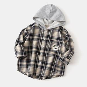 Close-up of kids hooded plaid shirt showing gray hood and cute bear embroidery patch