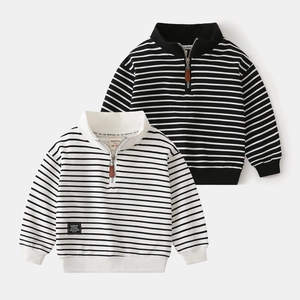 Detail of striped kids sweatshirt with half-zip collar and fashion label decoration