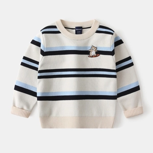 Close-up of striped kids sweater featuring fine bear embroidery and soft knit texture