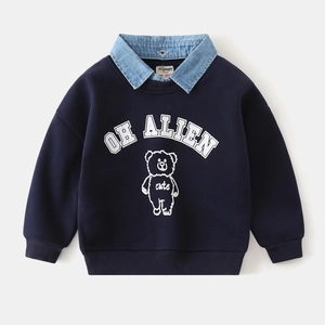 Detail of boys' navy blue sweatshirt with denim collar, bear print and white lettering