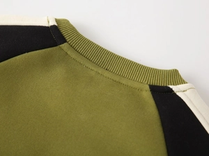 Close-up of the ribbed crew neck on a thick army green fleece sweatshirt for boys