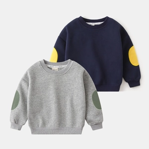Detail view of boys cotton sweatshirts with ribbed cuffs and contrast elbow patches