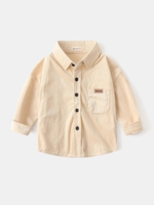 Boys cream corduroy long sleeve shirt with front buttons and chest pocket detail