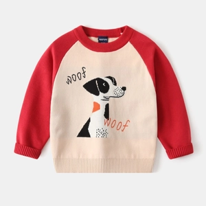 Detail of knit child sweater with a cute Dalmatian puppy pattern and contrast sleeves