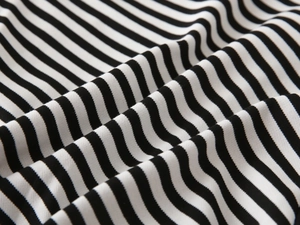Close-up of black and white striped pique fabric texture on toddler hooded sweatshirt