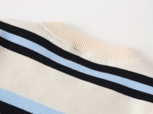 Close-up of the ribbed crewneck and fine knit texture on this striped toddler sweater
