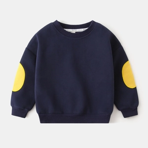 Detail of dark blue kids' sweatshirt with yellow elbow patches and ribbed cuffs