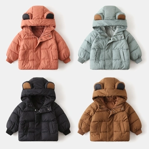 Detail view of colorful hooded kids winter puffer jackets with cute bear ears design