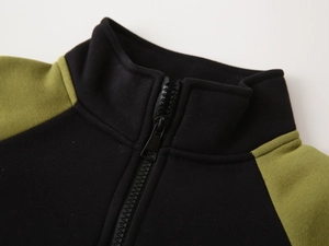 Detail shot of the stand collar and smooth zipper on this two-tone fleece kids jacket