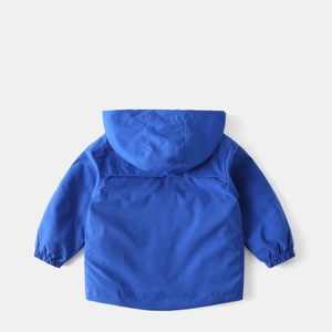 Back view of blue hooded windbreaker with elastic cuffs and windproof pleated detail