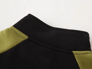 Detail of high-quality stitching on kids fleece-lined color block collar and shoulder seam