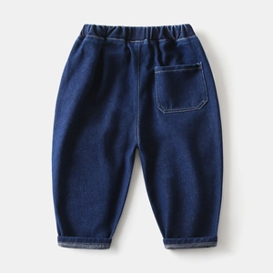Detail of boys' indigo denim pants showing elastic waistband and back pocket stitching