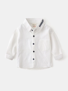 Flat lay of a white long sleeve cotton linen boy shirt with navy blue Sunday embroidery