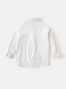 Back view of boys' white long-sleeve cotton shirt with back pleat and refined texture