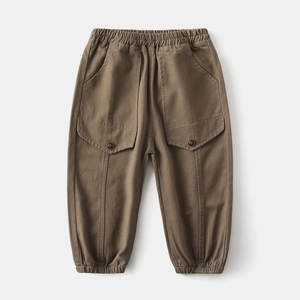 Detail showing elastic waistband and button flap cargo pockets on boys cotton pants