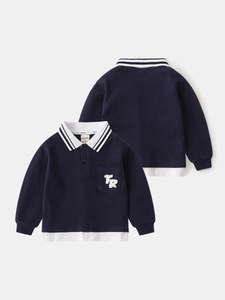 Boys long sleeve navy waffle knit polo shirt with white collar and layered hem