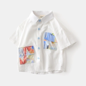 Detailed view of kids cotton shirt featuring artistic abstract colorful print pockets